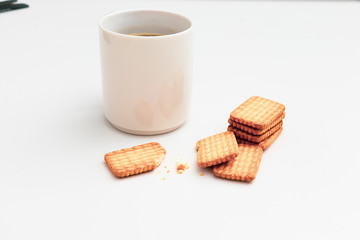 Obraz na płótnie Canvas Cup of coffee and biscuit on table Flat lay