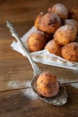 Small homemade donuts close-up on the table. Sweet dessert. cheese round donuts.
