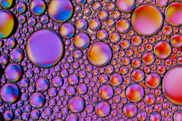 Abstract textured background of colorful oil and water bubbles