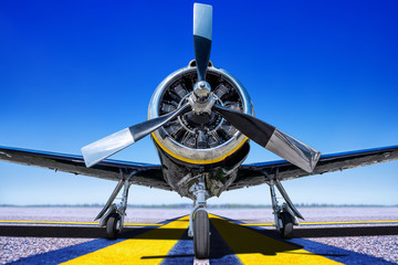 historical sports plane on a runway