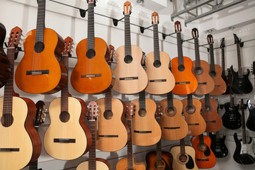 Rows of different guitars in music store