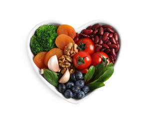 Bowl with products for heart-healthy diet on white background, top view
