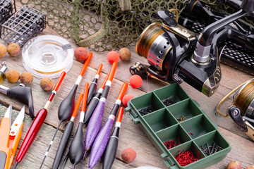 Obraz na płótnie Canvas fishing tackle on a wooden table. toned image 