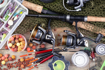 fishing tackle on a wooden table. 