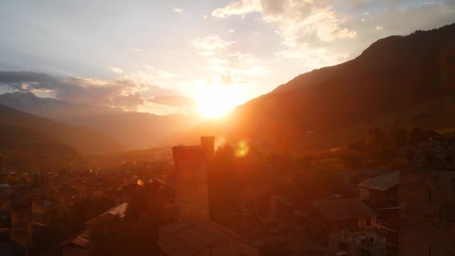 Sunset behind the mountains over Mestia. Georgia