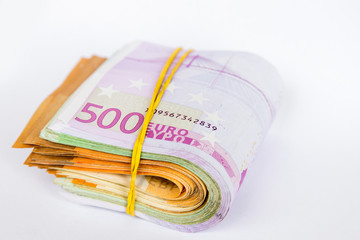 Pile of Euro banknotes isolated on a white background