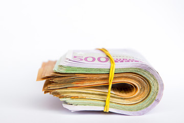 Pile of Euro banknotes isolated on a white background