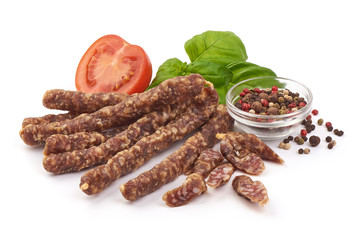 Dry wild meat sticks. Jerky sausages close-up, isolated on white background
