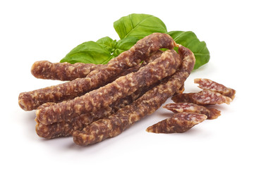 Dried thin pork sausages, smoked meat, close-up, isolated on white background