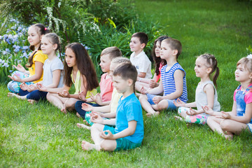 Fototapeta na wymiar children practicing yoga.