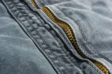 clothing items washed cotton fabric texture with seams, clasps, buttons and rivets