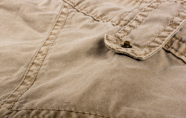 clothing items washed cotton fabric texture with seams, clasps, buttons and rivets
