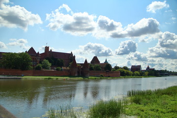 Naklejka na ściany i meble Malbork Castle across the river Nogat