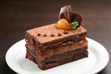 The cake, in German , is a typical Austrian chocolate cake, consisting of two thick plates of chocolate sponge cake and butter separated by a thin layer of apricot jam