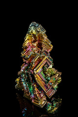 Macro of the stone bismuth mineral on a black background