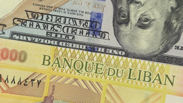 Lebanon pound against US dollar bill rotating. Lebanon and USA trade. 4K stock video footage