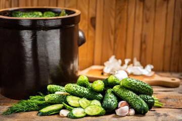 pickled cucumbers in a stone pot