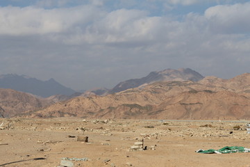 Fototapeta na wymiar Garbage dump in a desert. Environmental pollution.