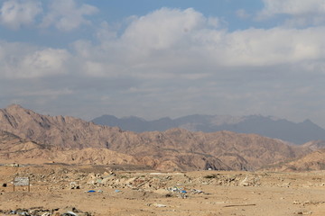 Garbage dump in a desert. Environmental pollution.