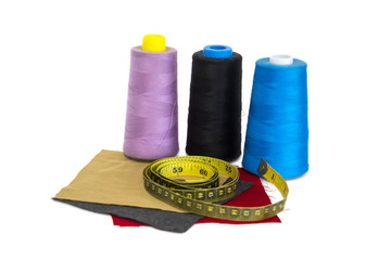 Thread spool fabric centimeter on white background.