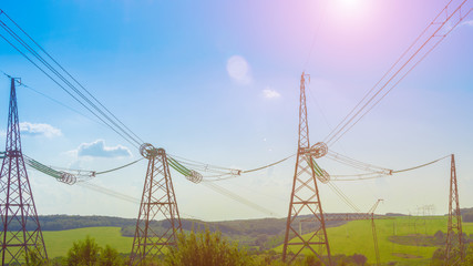 power line close up against the blue sky. Power industry