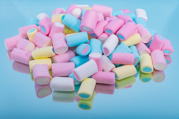 Colorful marshmallow on a mirror