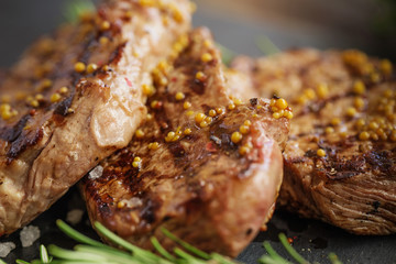 Grilled beef steaks with spices.