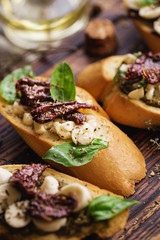 sandwich with mozzarella cheese, pesto, sun-dried tomatoes and basil and thyme