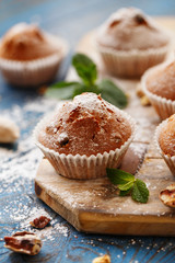 Sweet muffins. Homemade bakery on wooden background. Berry muffins