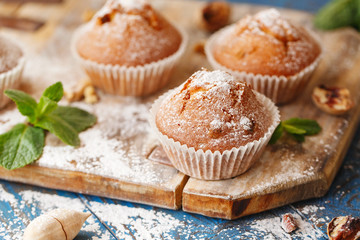 Sweet muffins. Homemade bakery on wooden background. Berry muffins