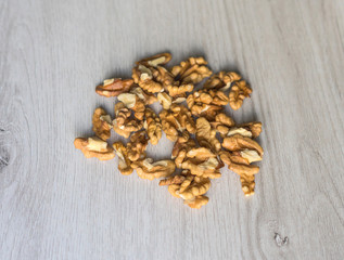 Healthy food  for background image close up walnuts.  Nuts  texture on white grey table top view
