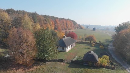 Traditional homes with handmade, thatched roofs in Ukrainian countryside