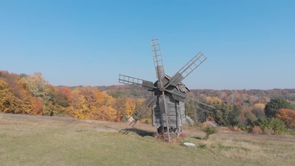 Ukraine. Ancient wooden windmill in meadow