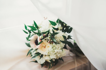 Beautiful wedding bouquet with different flowers, roses