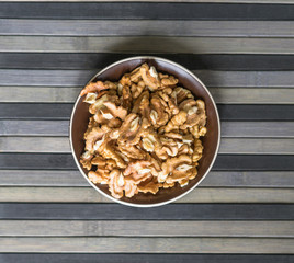 Healthy food  for background image close up walnuts.  Nuts  texture on top view on the cup plate