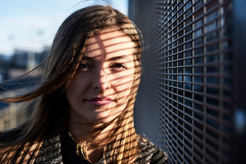 Portrait of young woman with shades on her face