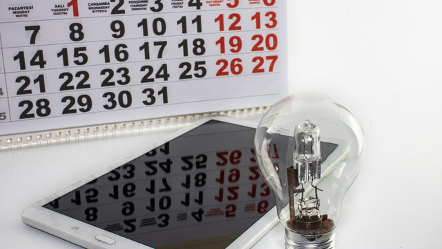 tablet, lamp and calendar