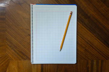 Notebook and pencil.