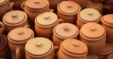 Georgia. Pots with lids and handles, displayed for sale at a public market