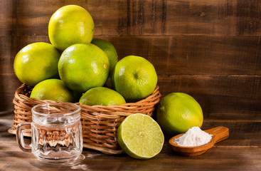 Glass of water, lemon, soda bicarbonate - Citrus × latifolia