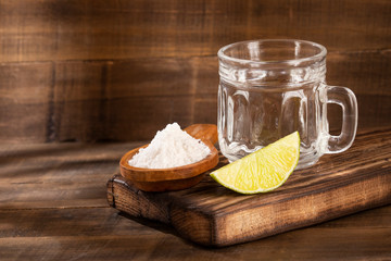 Glass of water, lemon, soda bicarbonate - Citrus × latifolia