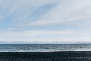 Black beach. Shore ocean. Atlantic Ocean