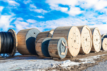 Wooden coils with a high-voltage cable of various sizes