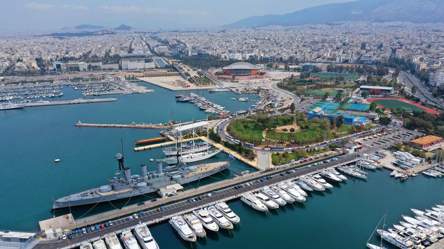 Aerial drone bird's eye view of small port and Park of Maritime Tradition where historic Averof warship is docked, Flisvos, Faliro Marina, Athens riviera, Attica, Greece