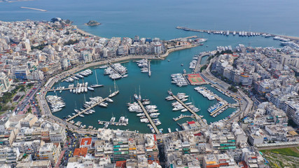 Fototapeta na wymiar Aerial drone photo of famous busy port and safe dock of Bay of Zea or Pasalimani (Pasha's harbour) in the heart of Piraeus, Attica, Greece