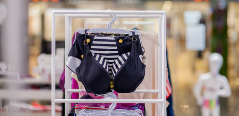 Women's swimsuits for sale at a seaside shop. Advertise, Sale, Fashion concept