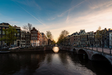 City view of Amsterdam, the Netherlands with Amstel river during sunset. © Prasit Rodphan