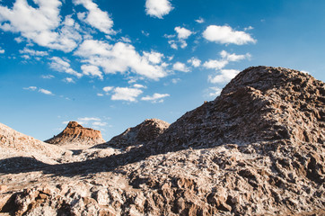 Some shite clouds and blue sky over Atacama desert hills, in Chile