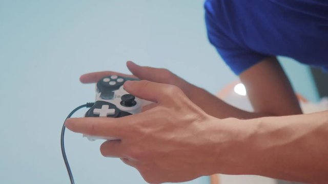 man concept playing gamepad hands video console on tv. Gamer play game with gamepad controller. Hand hold new joystick playing video lifestyle console on tv. Gaming man holding simulator joypad