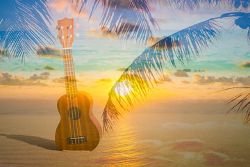Ukulele instrument on tropical beach background with palms and sky